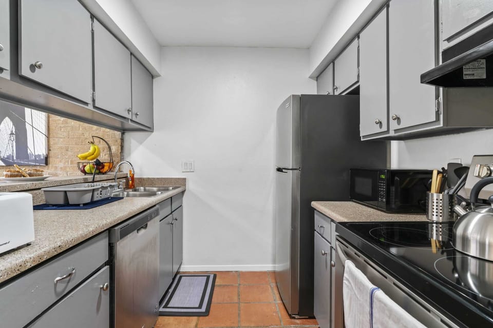 Fully stocked kitchen with all amenities for cooking at home or take out.