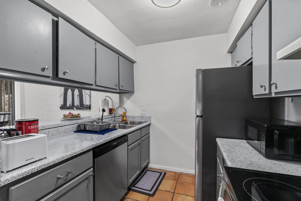 the kitchen features a bar that connects to the dining area