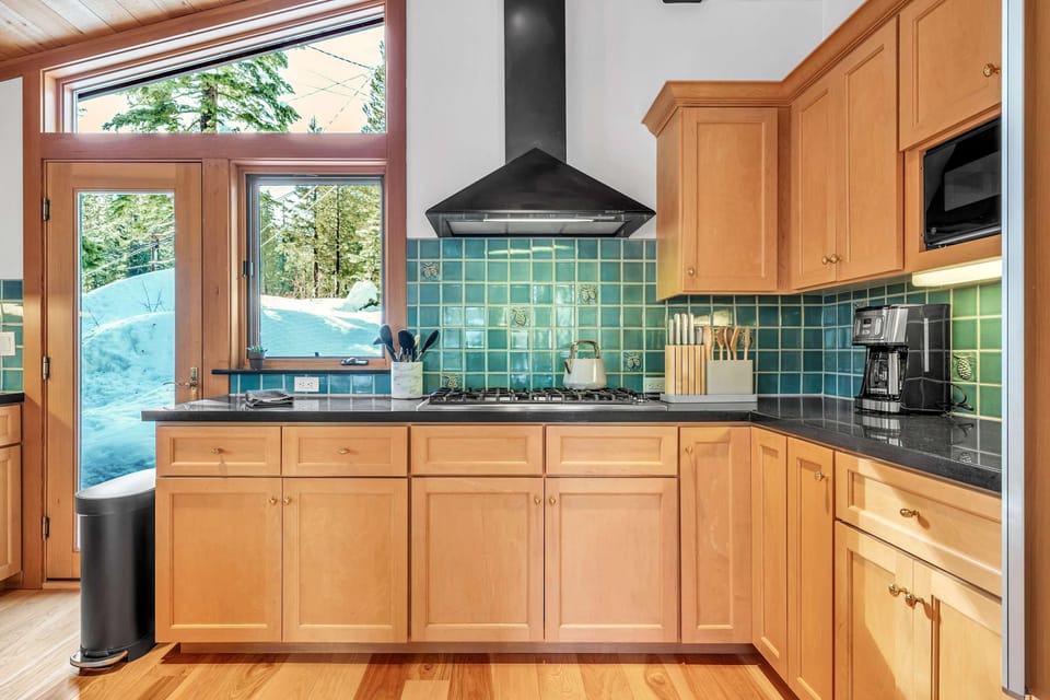 Kitchen: Sub-Zero fridge, Viking range, drip coffee maker, blender, toaster, cooking utensils, tableware