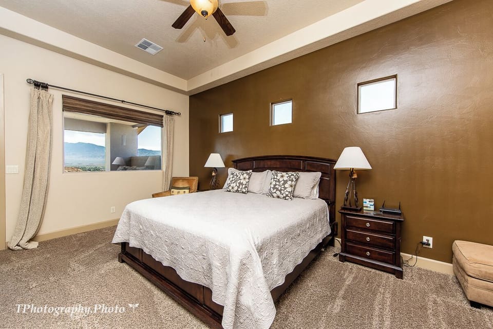 King suite with beautiful view and door opening up to the back panoramic patio