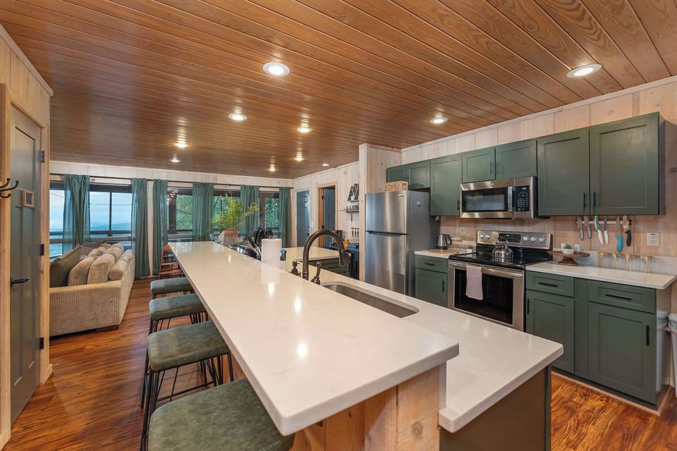 Gather around our spacious island with high seating, the perfect spot for casual meals and lively conversations.