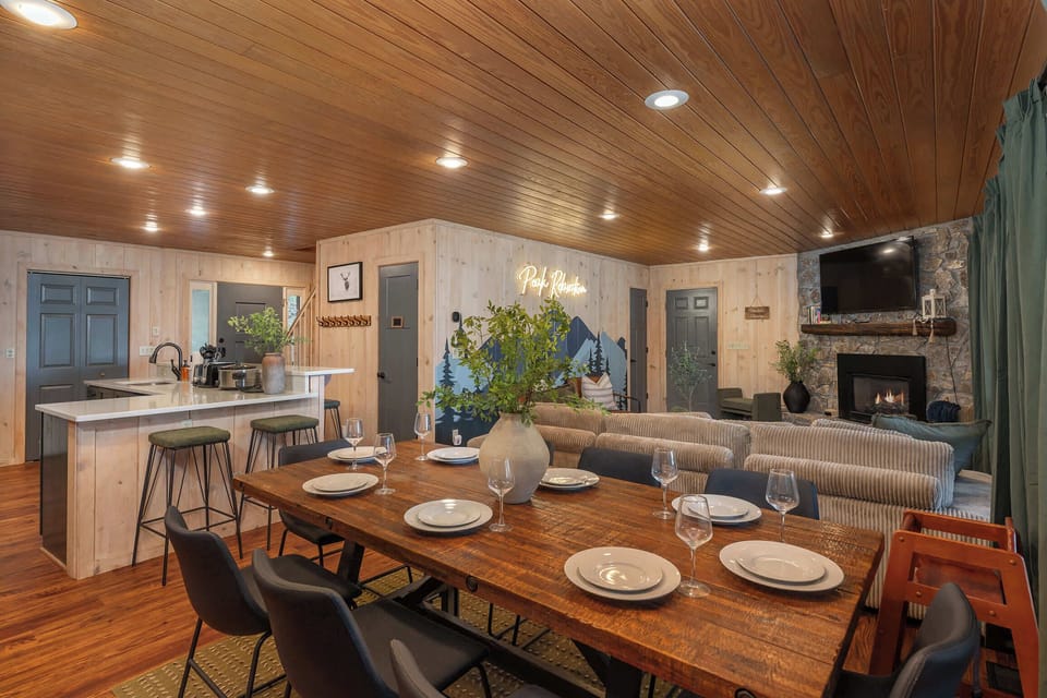 Our open floor plan with large windows invites the beauty of the mountains into every corner of the dining and living room.