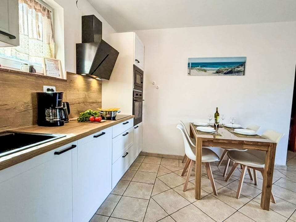 Countertop, Kitchen, Furniture, Kitchen Appliance, Major Appliance, Flooring, Wood, Interior Design, Floor, Cabinetry