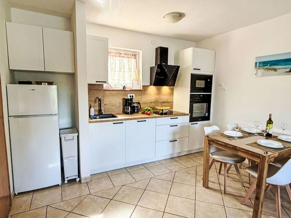Furniture, Kitchen Appliance, Kitchen, Major Appliance, Flooring, Countertop, Interior Design, Wood, Floor, Cabinetry