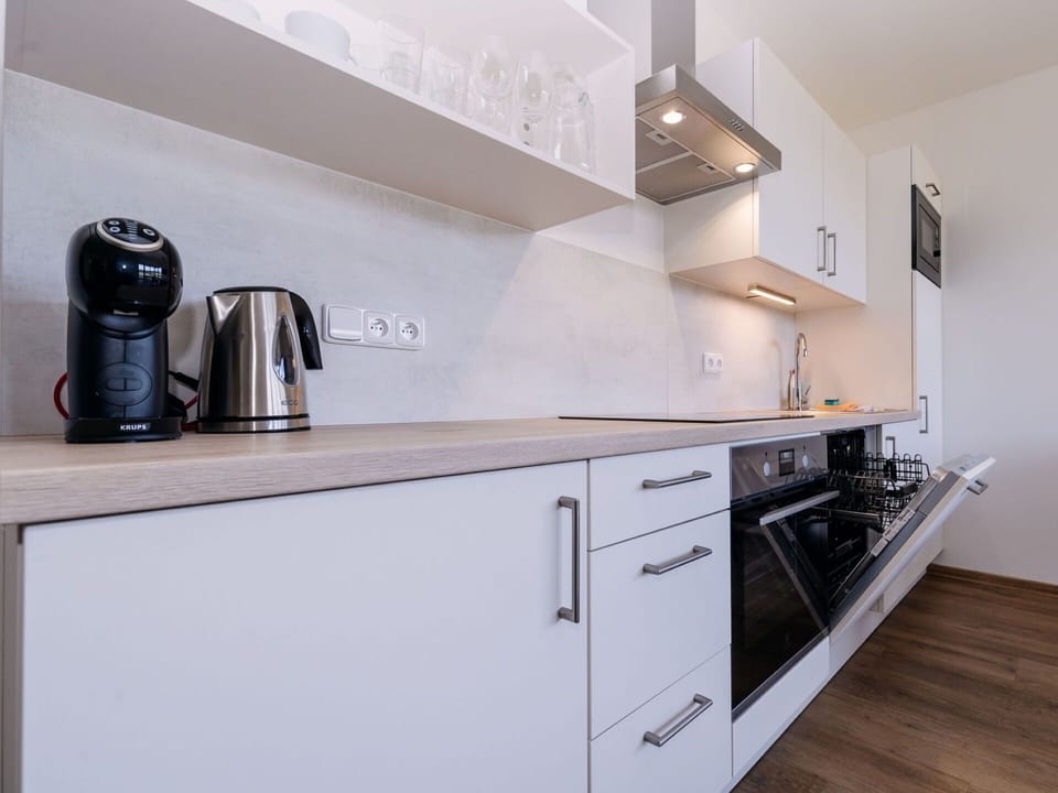 Countertop, Cabinetry, Kitchen Appliance, Interior Design, Kitchen, Flooring, Wood, Major Appliance, Floor, Room