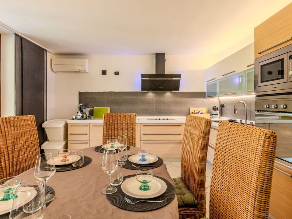 Furniture, Interior Design, Flooring, Floor, Countertop, Wall, Kitchen, Wood, Ceiling, Room