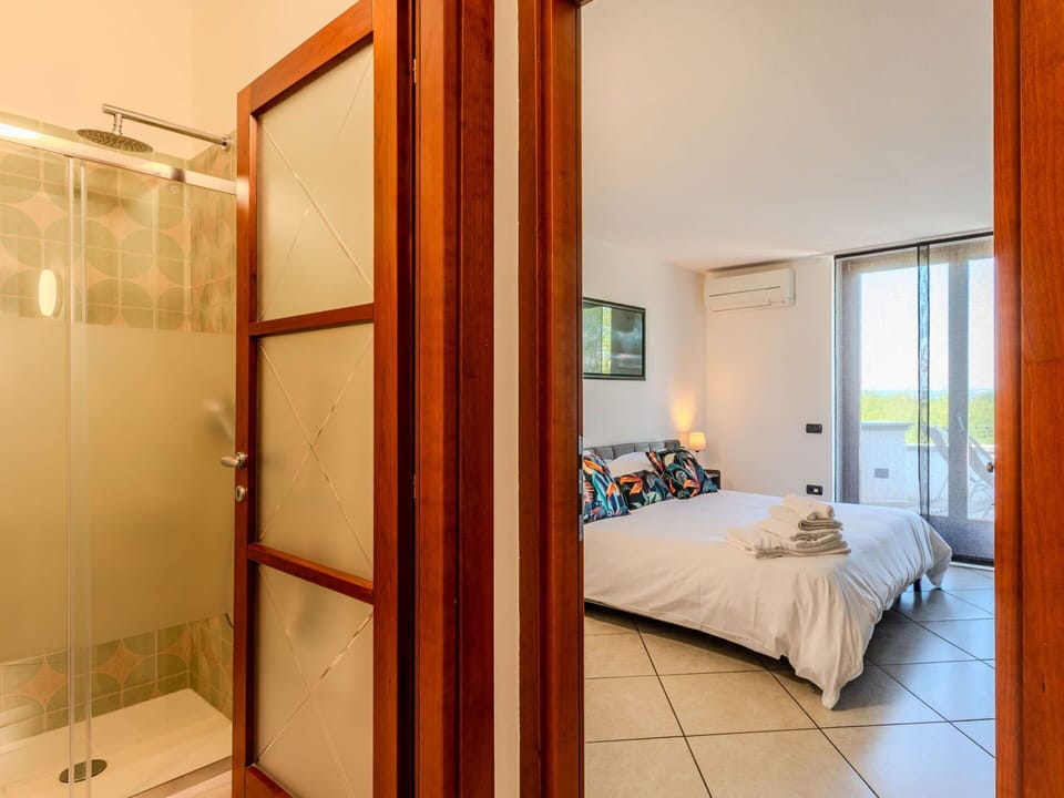 Interior Design, Flooring, Floor, Wood, Bed, Bedroom, Ceiling, Room, Furniture, Lighting