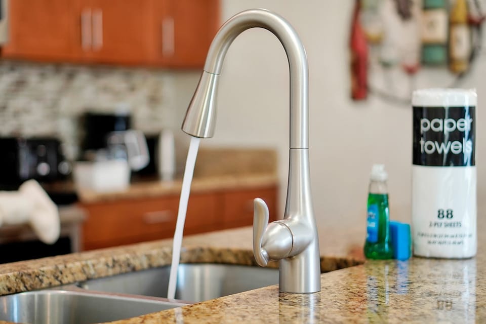 Modern convenience in every detail. Enjoy a sleek pull-down faucet and deep sink in the kitchen, making cleanup after family meals a breeze.