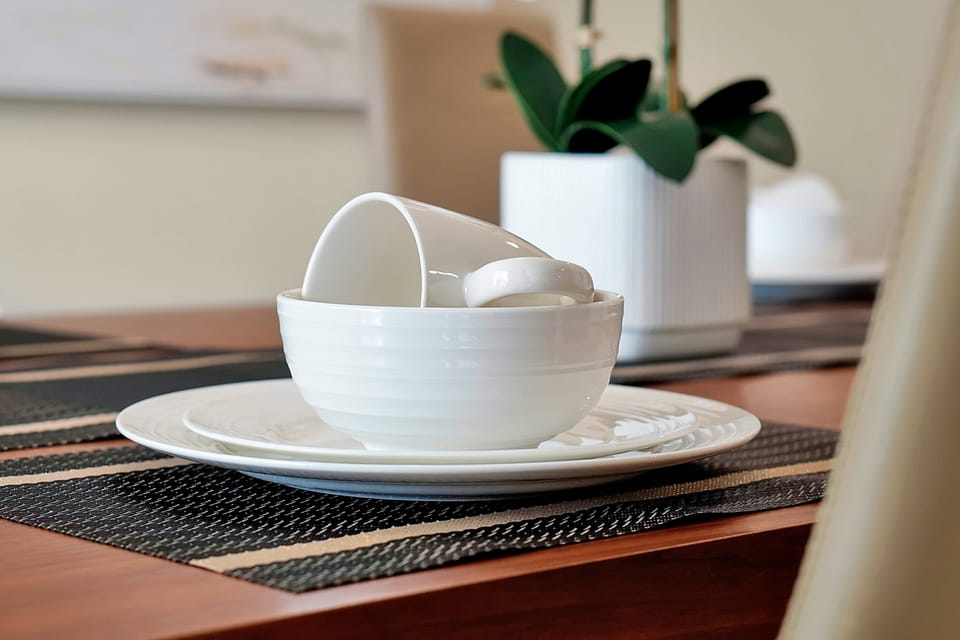 Ready for your morning coffee. We provide all the essentials, including quality dinnerware and glassware. Just bring the groceries!