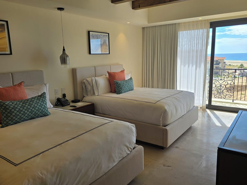 Second bedroom with 2 queen beds and balcony. 