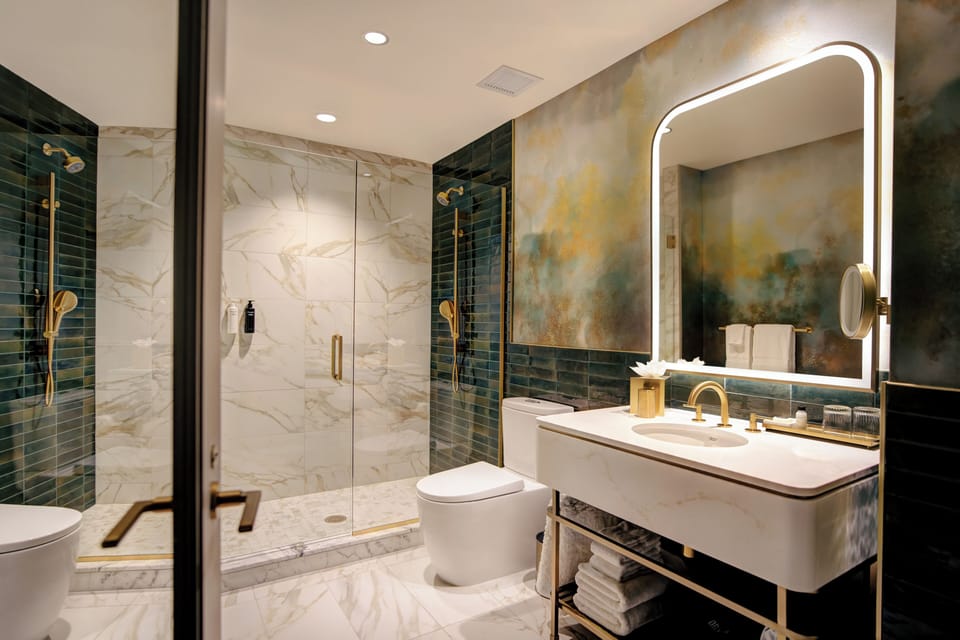 Ultra Suite | Bathroom | Hair dryer, towels, soap, shampoo
