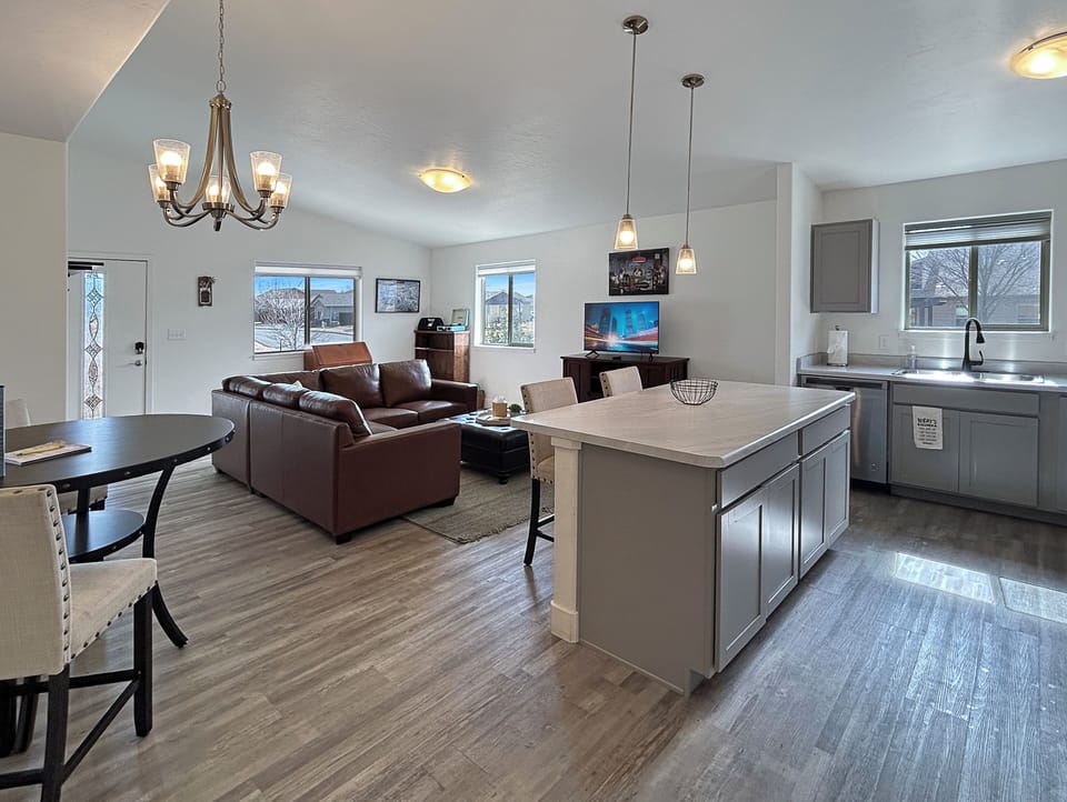 Settle into your bright open-concept space where your fully equipped kitchen island flows seamlessly into the cozy living room.