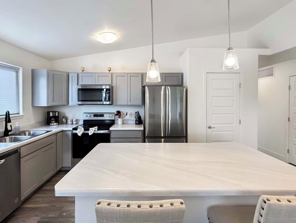 Full kitchen with island with coffee and drip coffee maker