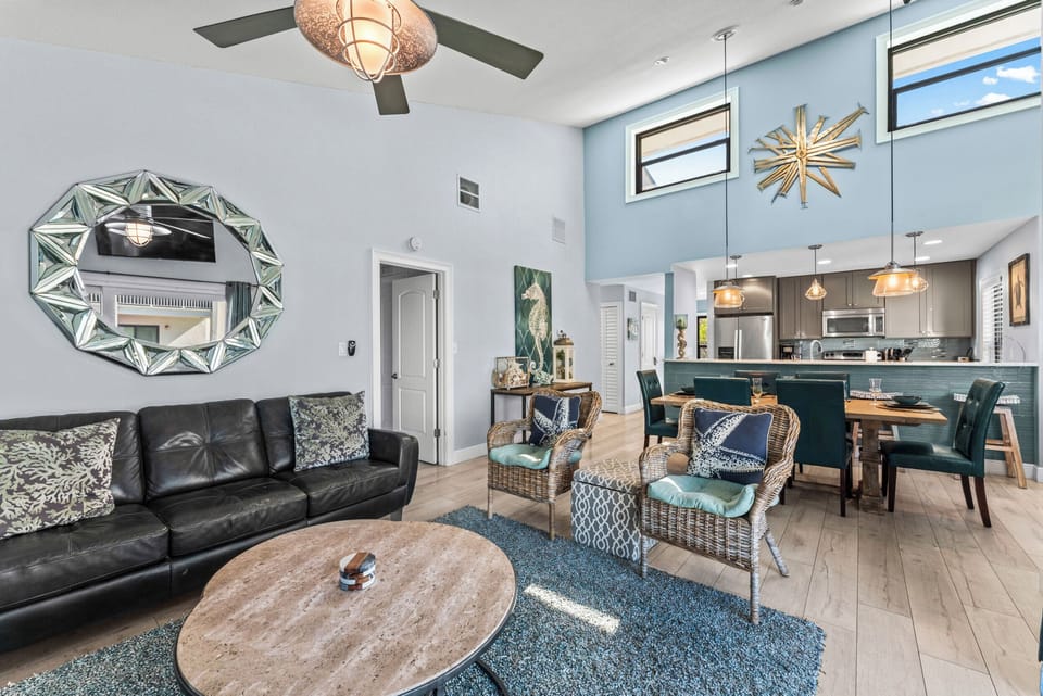 A spacious, open-concept dining area and living room with ample seating for dining and relaxation.