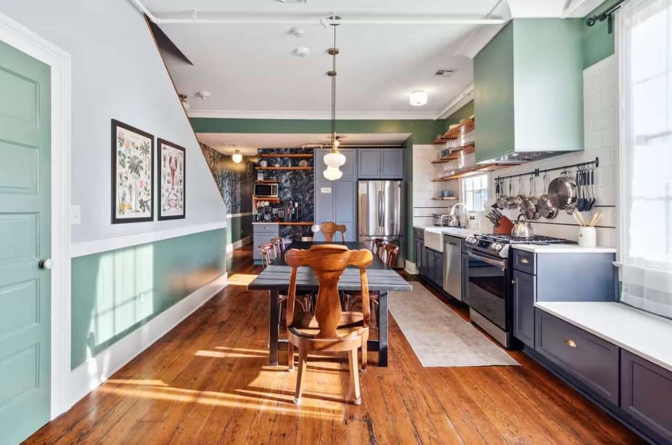 Bright and inviting kitchen with a dining table, full set of appliances, and all the cookware, dishes, and utensils you need to prepare meals with ease.