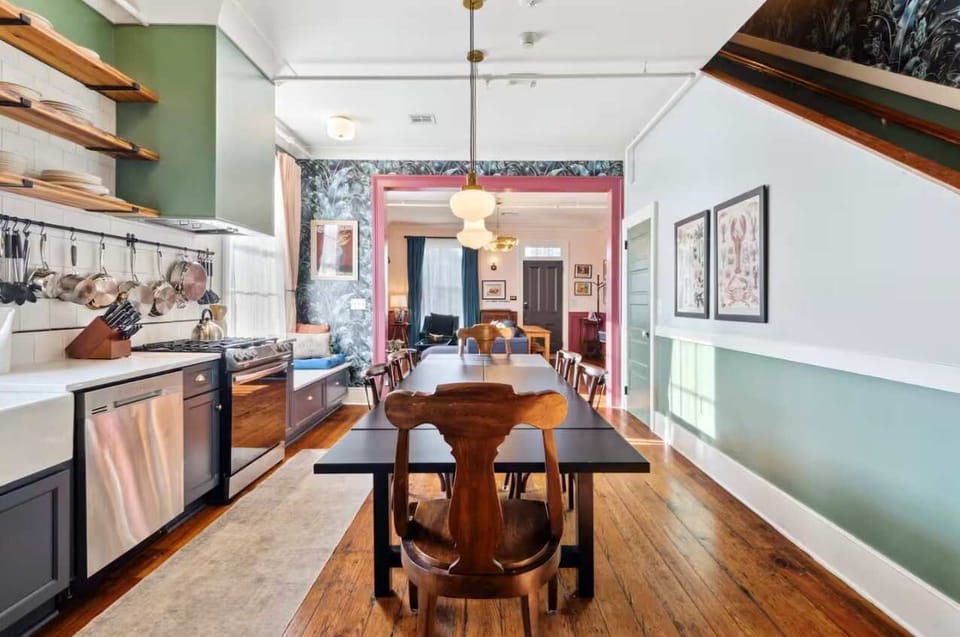 Bright and inviting kitchen with a dining table, full set of appliances, and all the cookware, dishes, and utensils you need to prepare meals with ease.