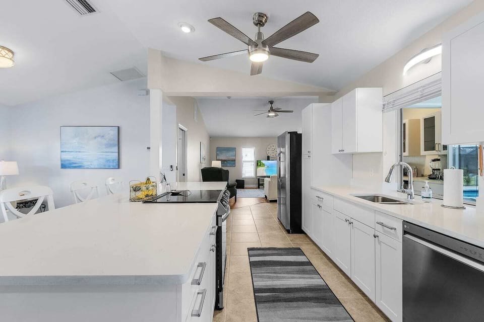 The renovated kitchen includes modern appliances, generous counter space, and everything you need for easy meals.