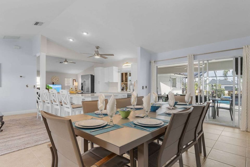 Gather around the large dining table with seating for family meals, games, or planning the day’s adventures.