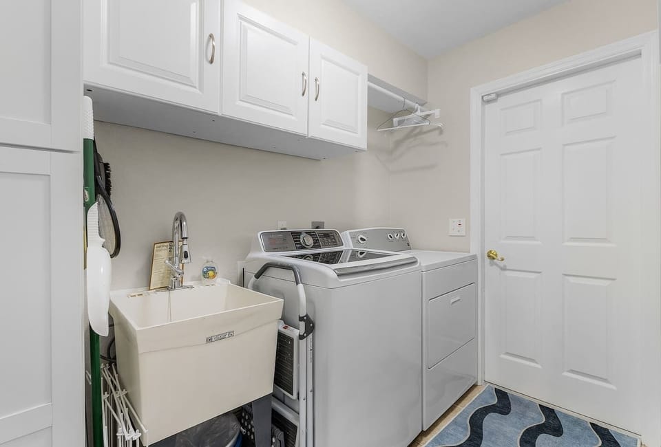 The dedicated laundry room makes longer stays, beach days, and family travel easier.