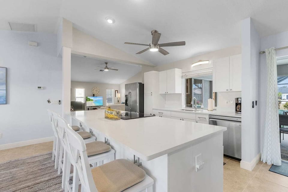 The open layout connects the kitchen, dining, and living areas so your group can spend time together comfortably.