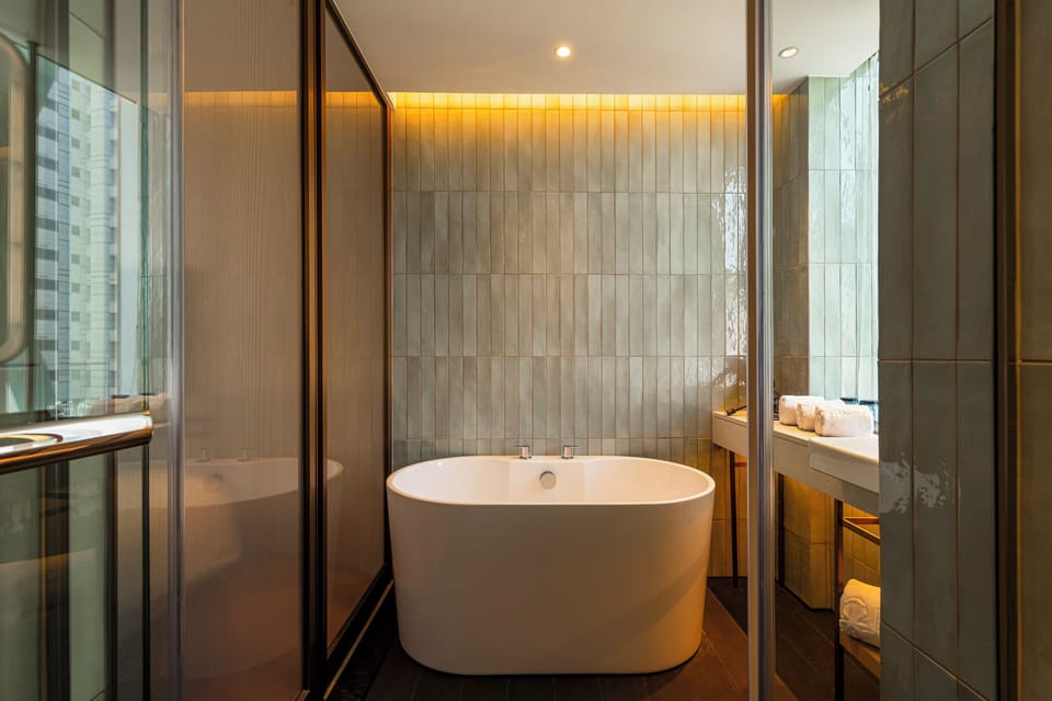 Deluxe Family Room -Standard Floor | Bathroom | Hair dryer, slippers, bidet, towels