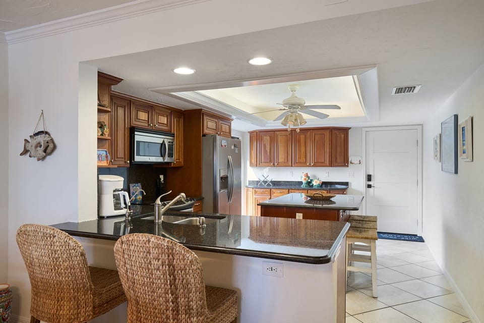 Full kitchen with island seating.