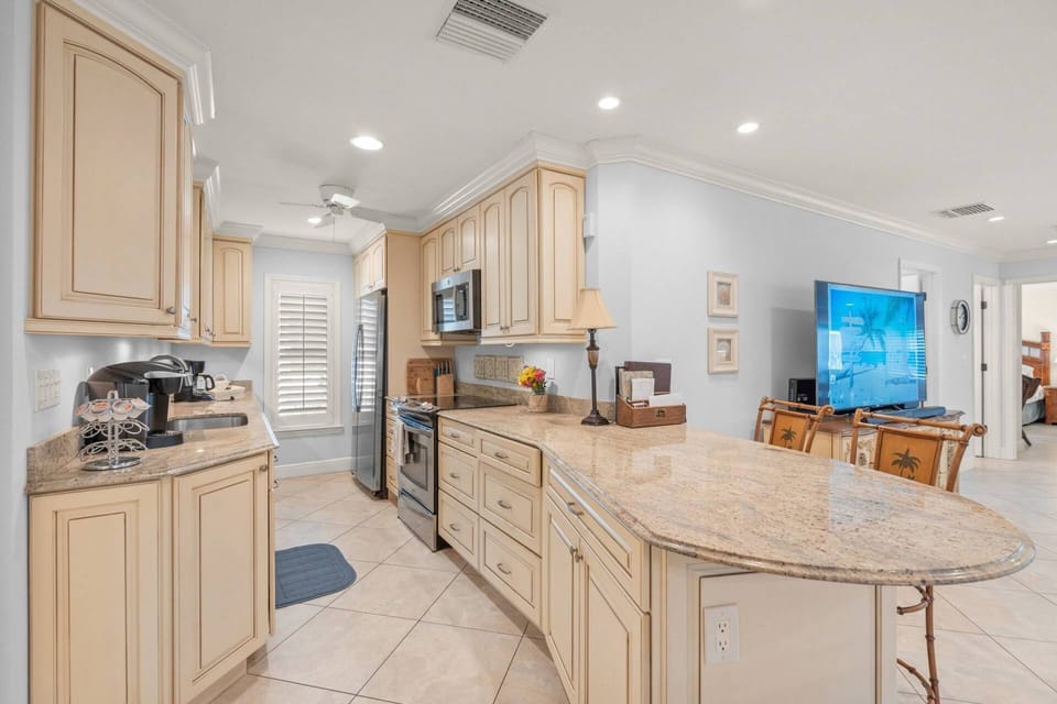 Spacious breakfast bar right by the kitchen and living room.