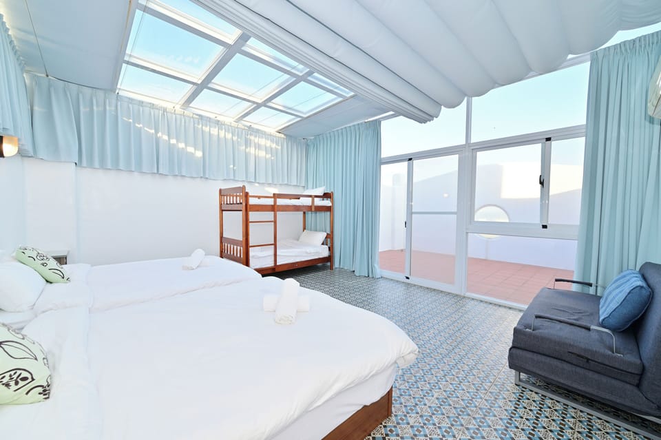 Sky Six Person Room | Individually decorated, laptop workspace, free WiFi