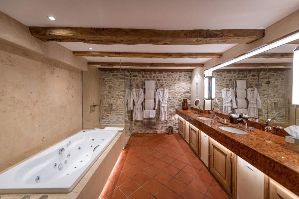 Separate tub and shower, hair dryer, bathrobes, slippers
