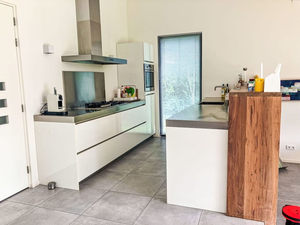 Flooring, Floor, Wood, Countertop, Kitchen, Interior Design, Kitchen Appliance, Furniture, Cabinetry, Home Appliance