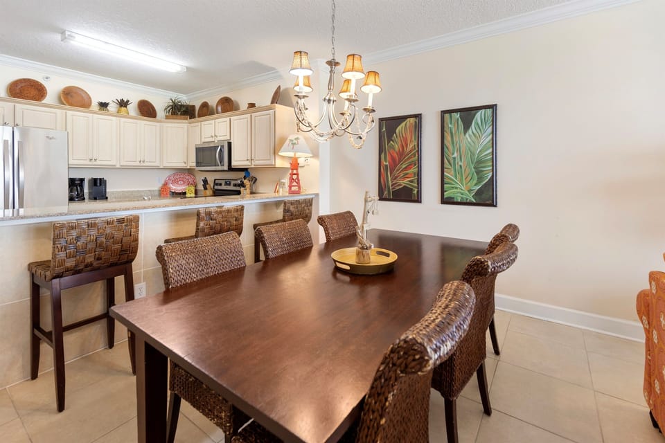 Gather around your spacious dining table with tropical touches, where the fully equipped kitchen makes meal prep effortless.