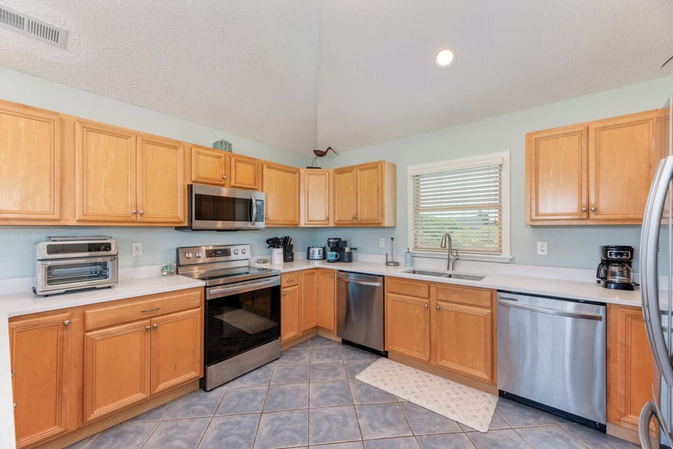 Kitchen with Bar Seating on Third Level