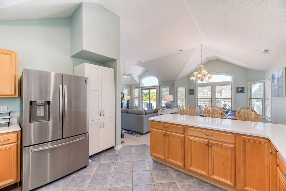 Kitchen with Bar Seating on Third Level