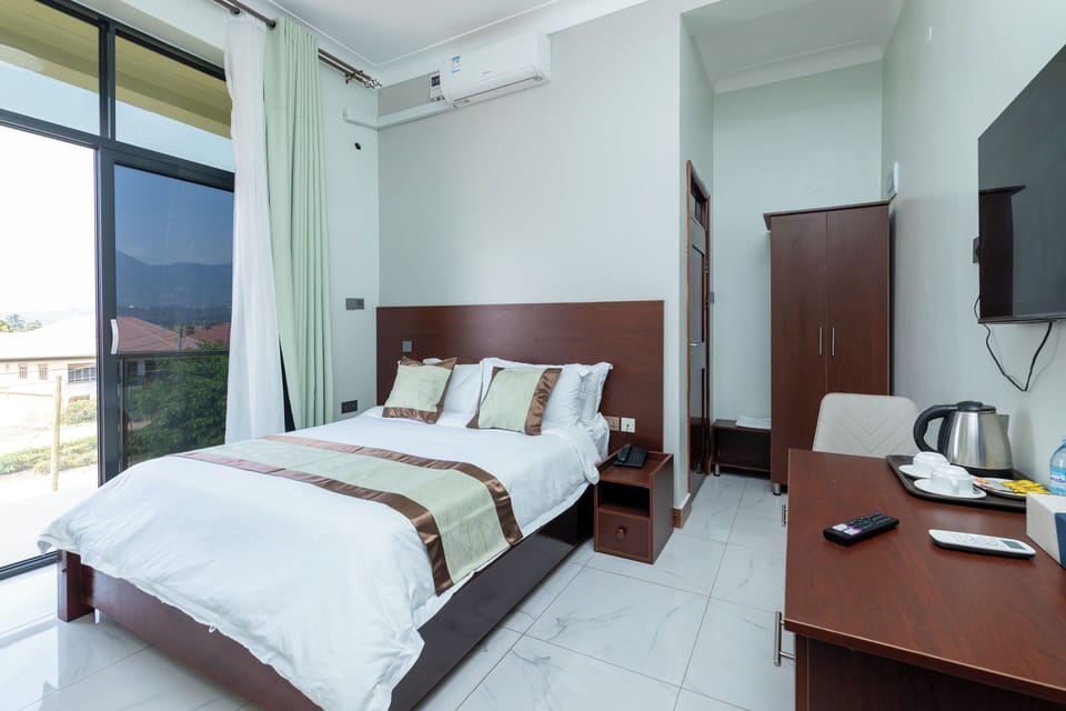 Deluxe Double Room, City View | Desk, laptop workspace, cribs/infant beds, free WiFi