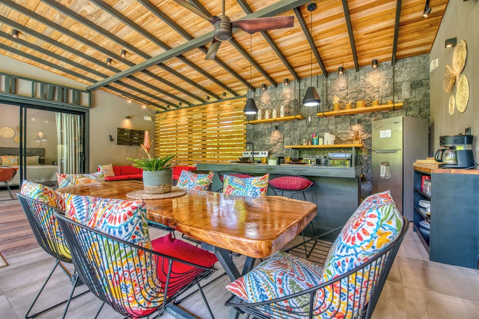 A beautiful custom Costa Rican wood dining table supports your large group. 