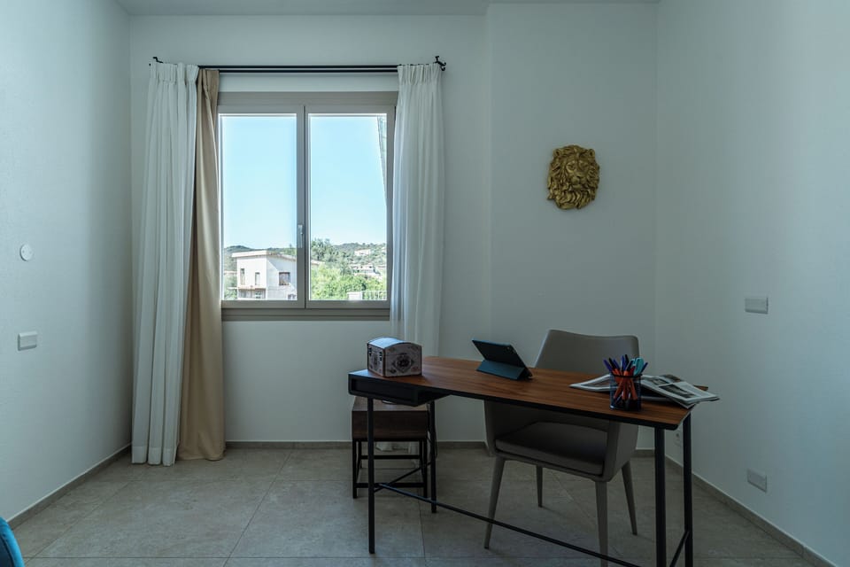 Villa, Pool View | Living area | 35-inch TV with digital channels