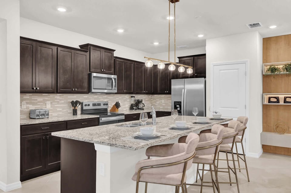 Fully Equipped Kitchen with Centered Island and Bar Stools