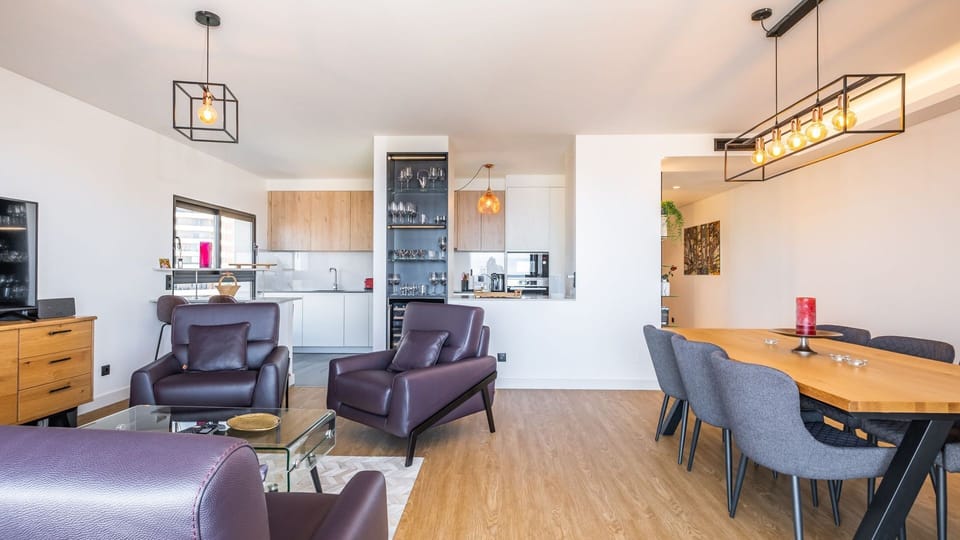 Relax in the stylish living room at SkyView Penthouse by LovelyStay, featuring modern furnishings. #modern #apartment #penthouse #funchal