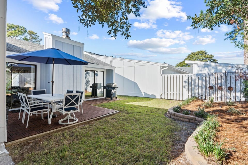 Private back lawn with propane grill