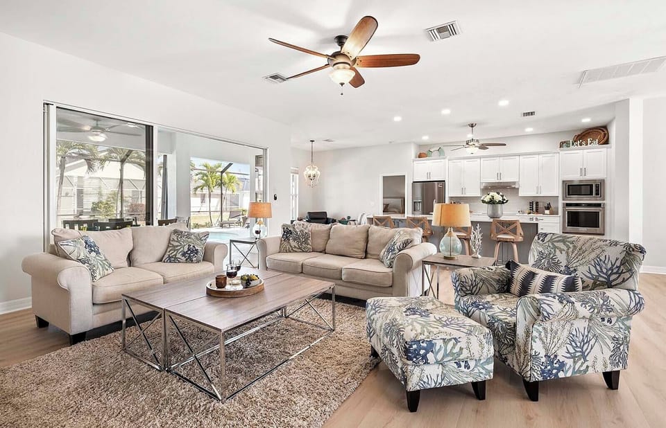 The Living Room is the Center of the Home with Views of the Kitchen, Dining, Sitting and Lanai