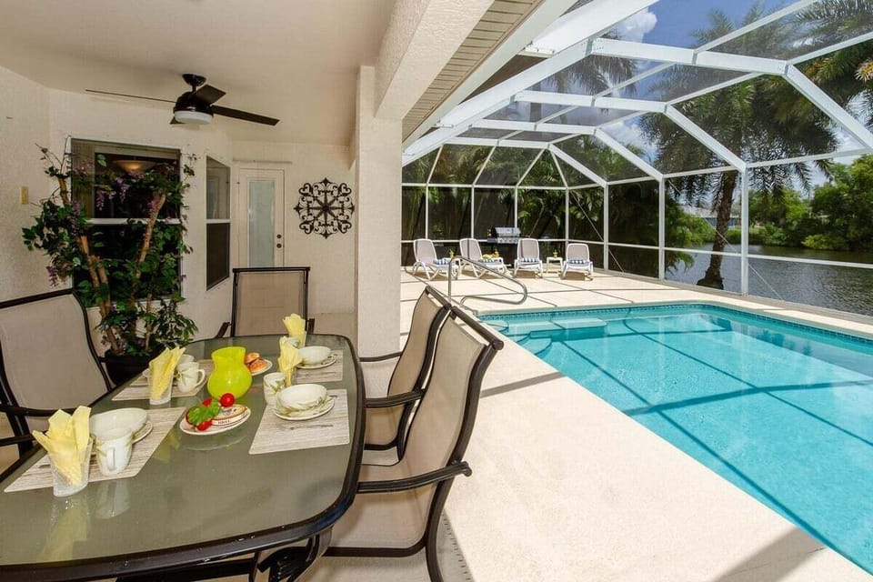 Covered Lanai for Outdoor Dining and View of the Pool