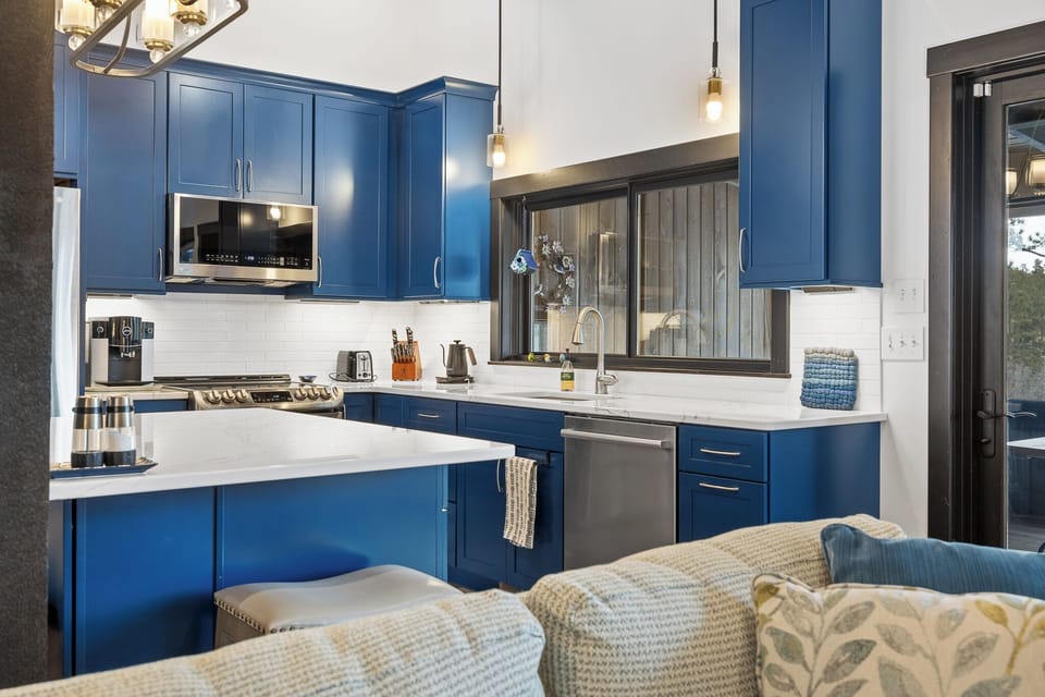 Sliding windows by sink open to screen porch on other side - serve with ease!
