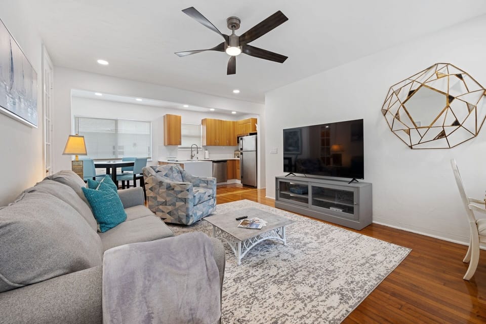 Comfy living room, pull out couch, ceiling fan, 65” SMART HDTV