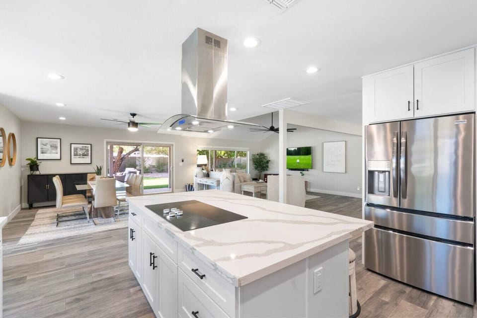 The heart of the home, seamlessly connecting the kitchen, dining, and living spaces.