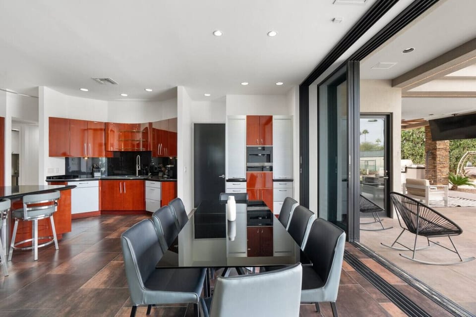 Dining area opens seamlessly to the patio, blending indoor comfort with outdoor living.
