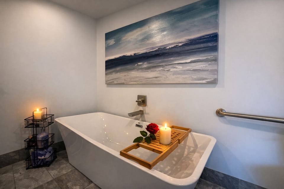 Slip into serenity in this spa-style soaking tub. Candlelight, a single rose, and peaceful artwork set the mood for true relaxation. After a full day of fun, this is your private retreat to recharge and indulge.