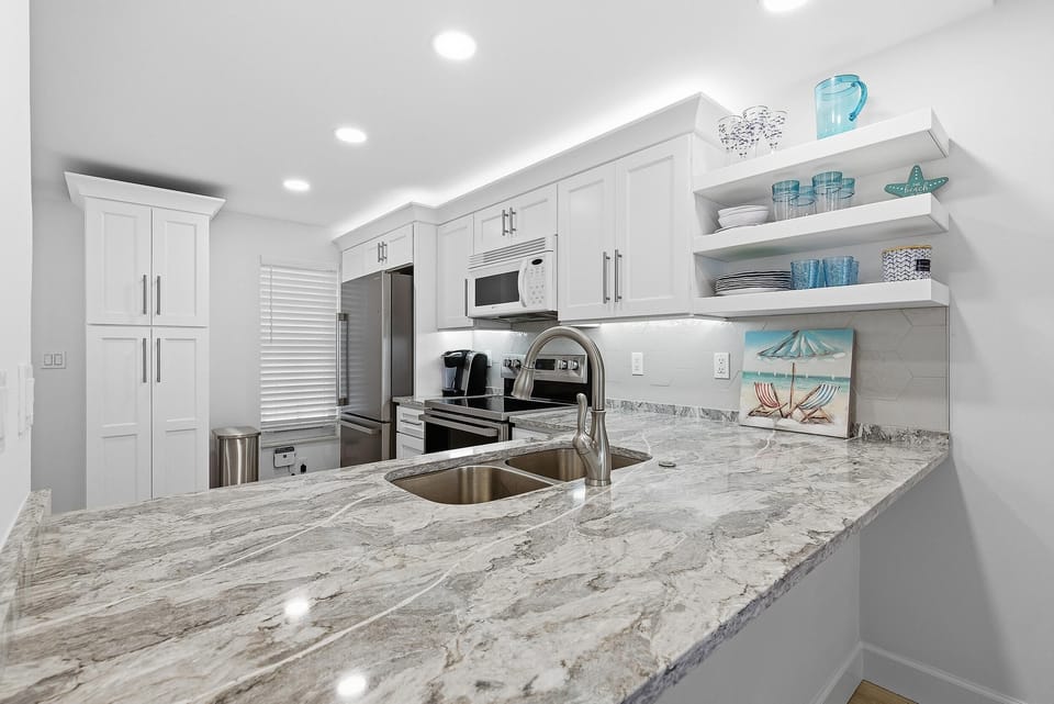 Condo, 1 King Bed with Sofa bed (Point East 301) | Private kitchen | Oven, coffee/tea maker, toaster, blender