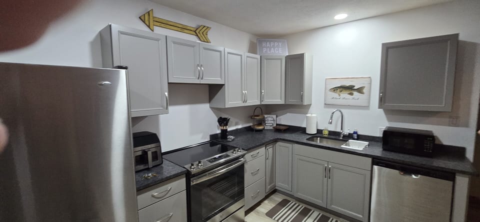 Kitchen w/large refrigerator, dish washer, air fryer, coffee bar, microwave