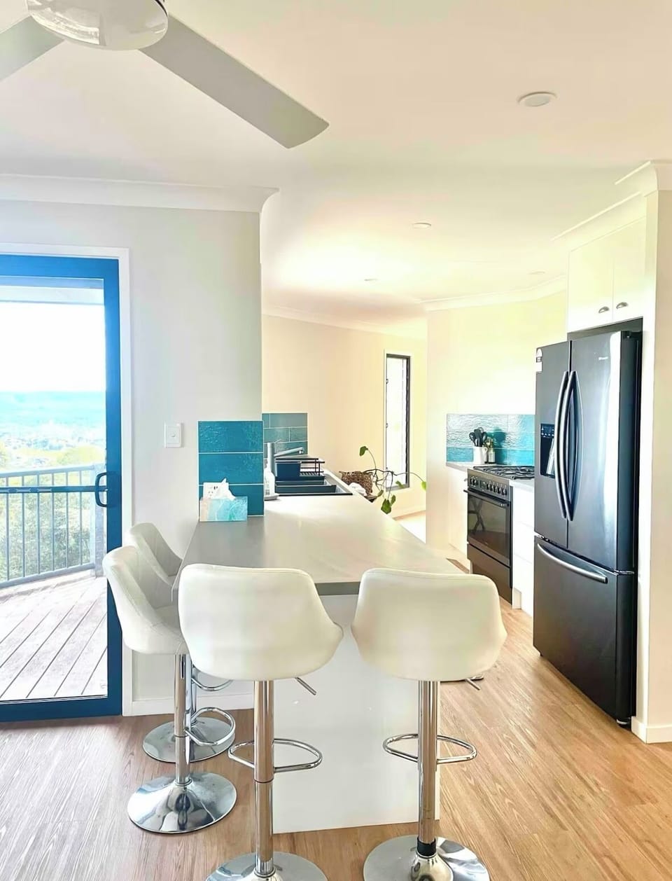 full chef kitchen with pantry, large oven, gas top, microwave, coffee pod mach