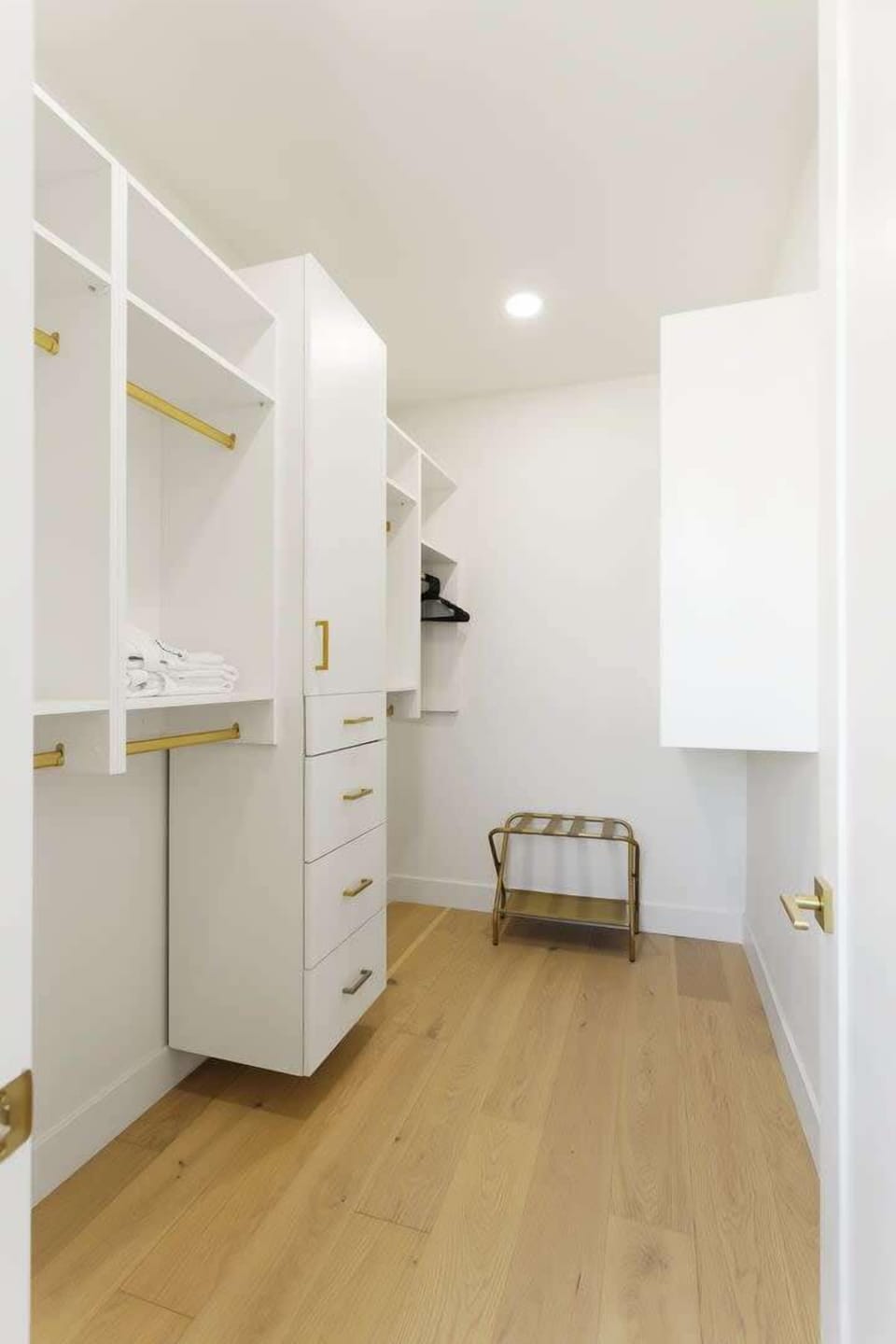 Primary Bedroom featuring a King bed, designer furnishings, work station, 2 walk-in closets, en-suite bathroom, and a private balcony.